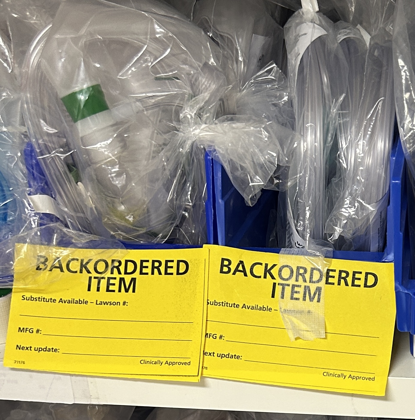 Backordered medical supply items stored in labeled bins